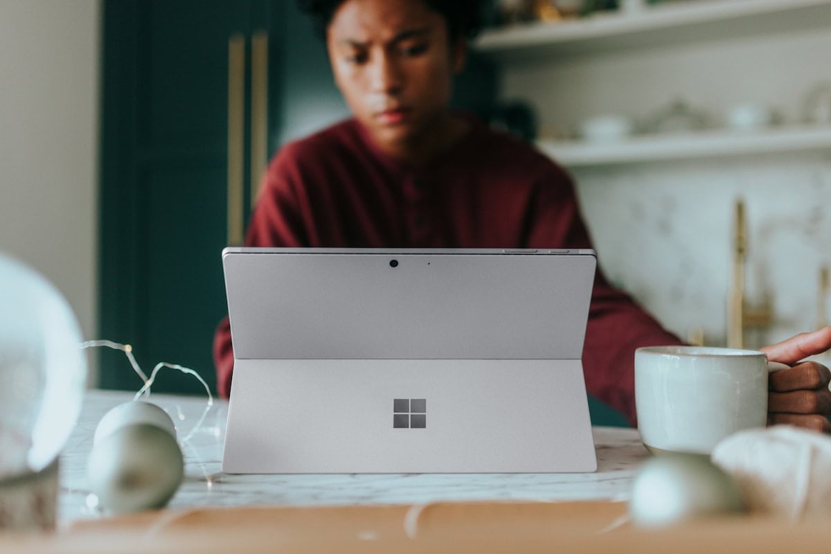 Best place to buy Microsoft Office 2021 key in 2026 shown on a laptop with a price tag and location pin