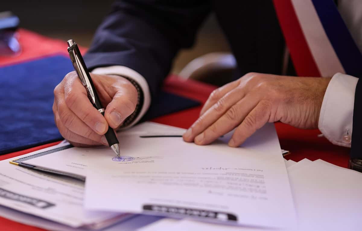 OEM license key legal guide - person signing a document